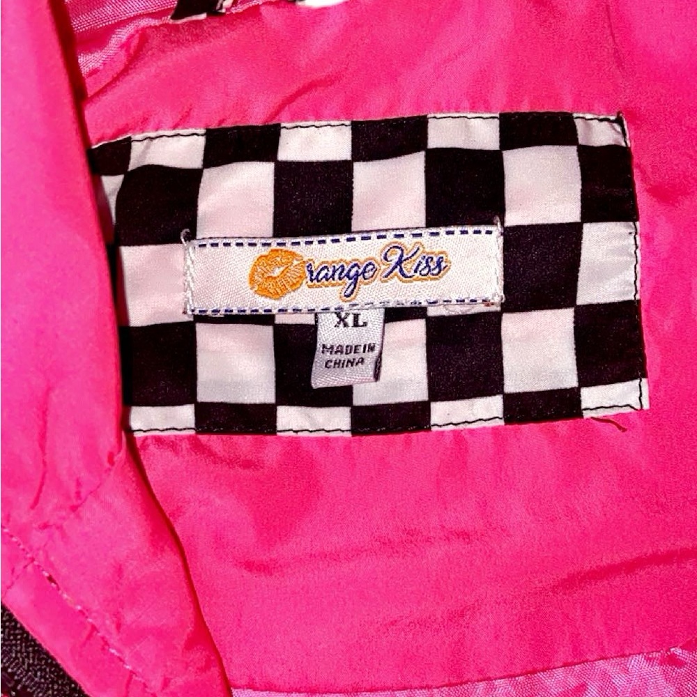 Pink & black & white checkers wind breaker with hood.